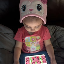 A child wearing CozyPhones